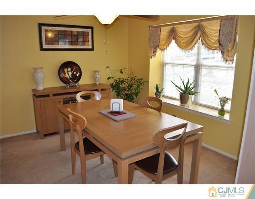 151 Skipton Place Somerset, NJ 08873 - Photo 5 of 10 a view of a dining room with furniture and window