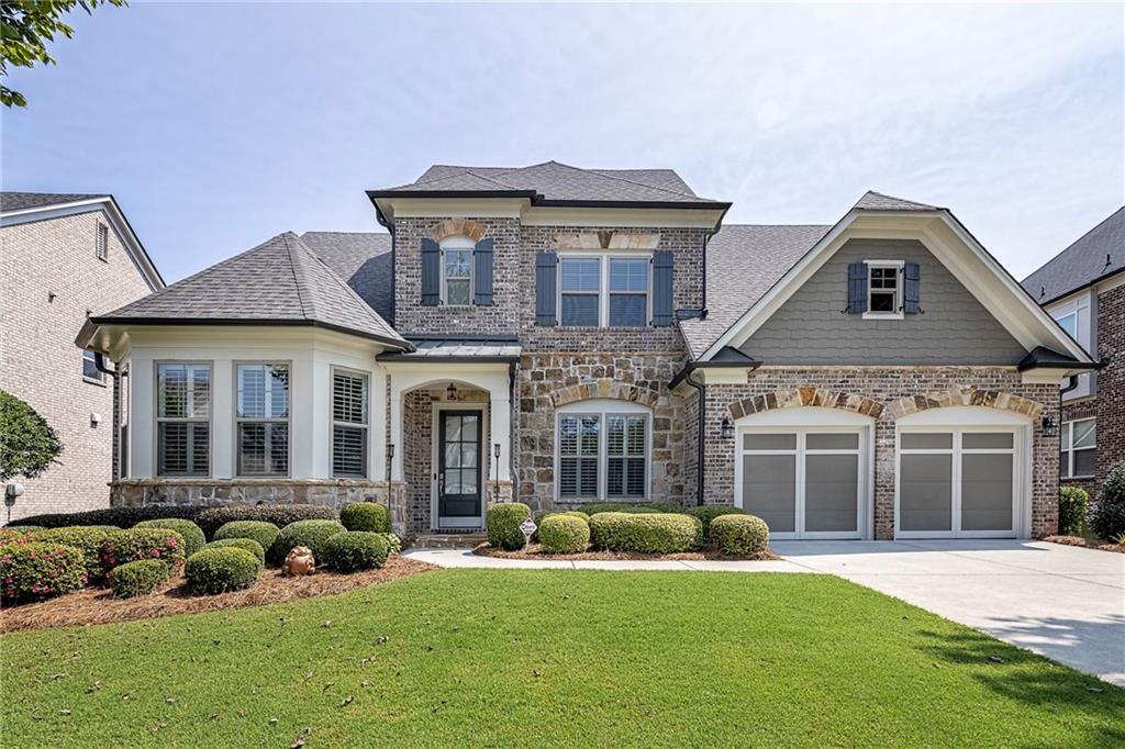 a front view of a house with a yard