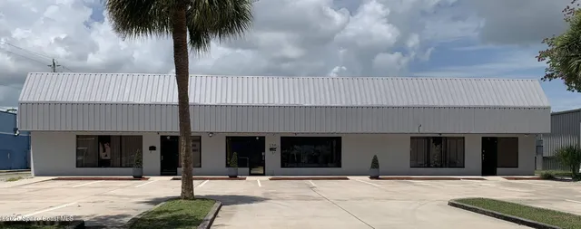 a front view of a building with street view