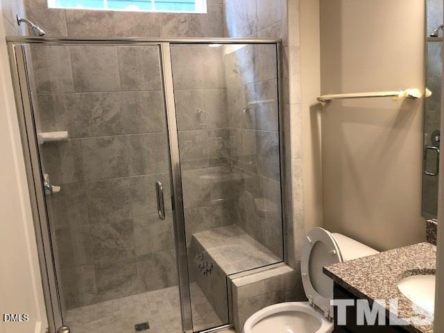 1600 Silo Ridge Drive Wake Forest, NC 27587 - Photo 7 of 16 a bathroom with a shower and toilet