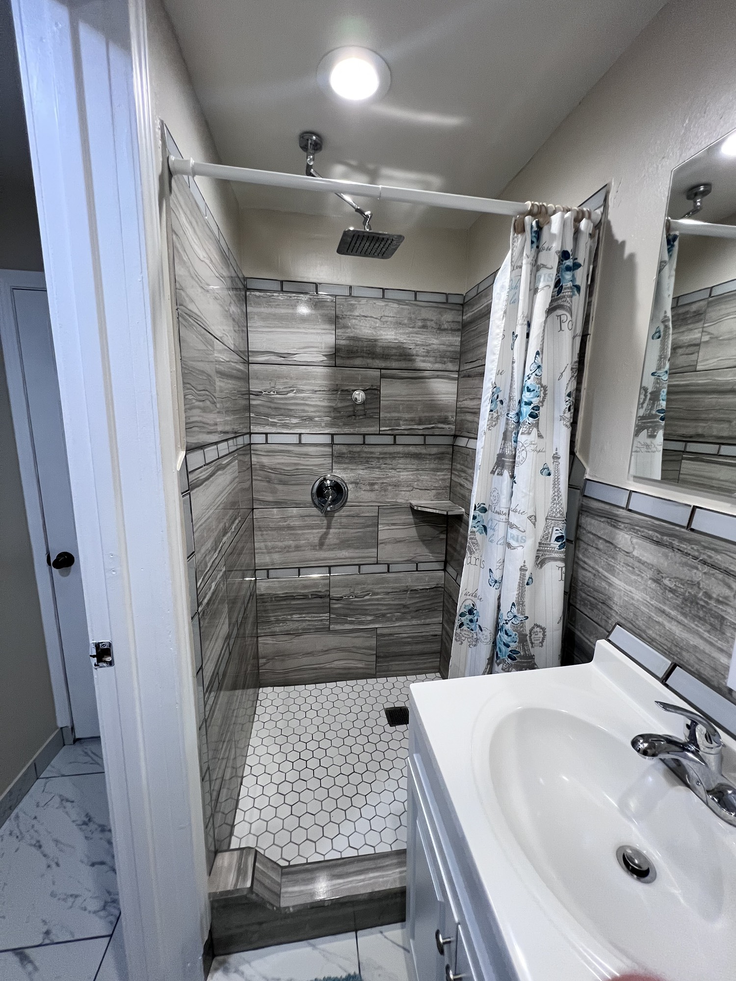 10807 Spring Harvest Drive Houston, TX 77064 - Photo 8 of 12 a bathroom with a sink and shower