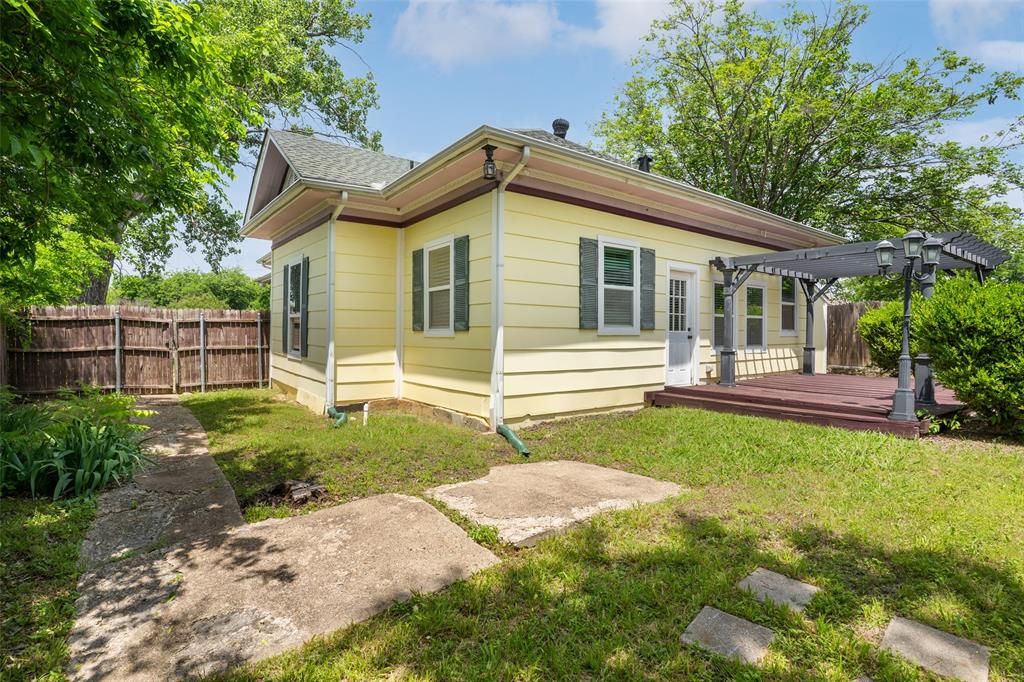 5824 Boone Street Sachse, TX 75048 - Photo 28 of 40 a front view of a house with garden
