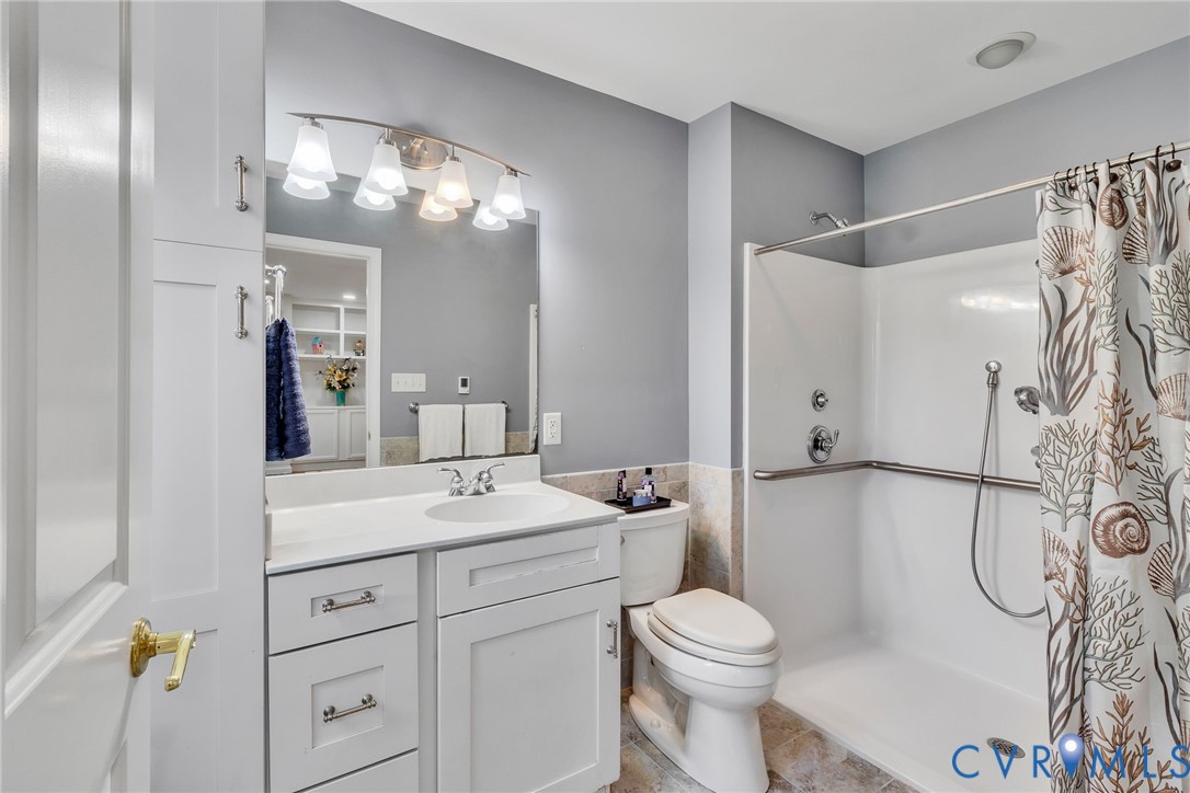 618 Main Street Reedville, VA 22539 - Photo 22 of 54 Bathroom featuring a white vanity with a single si