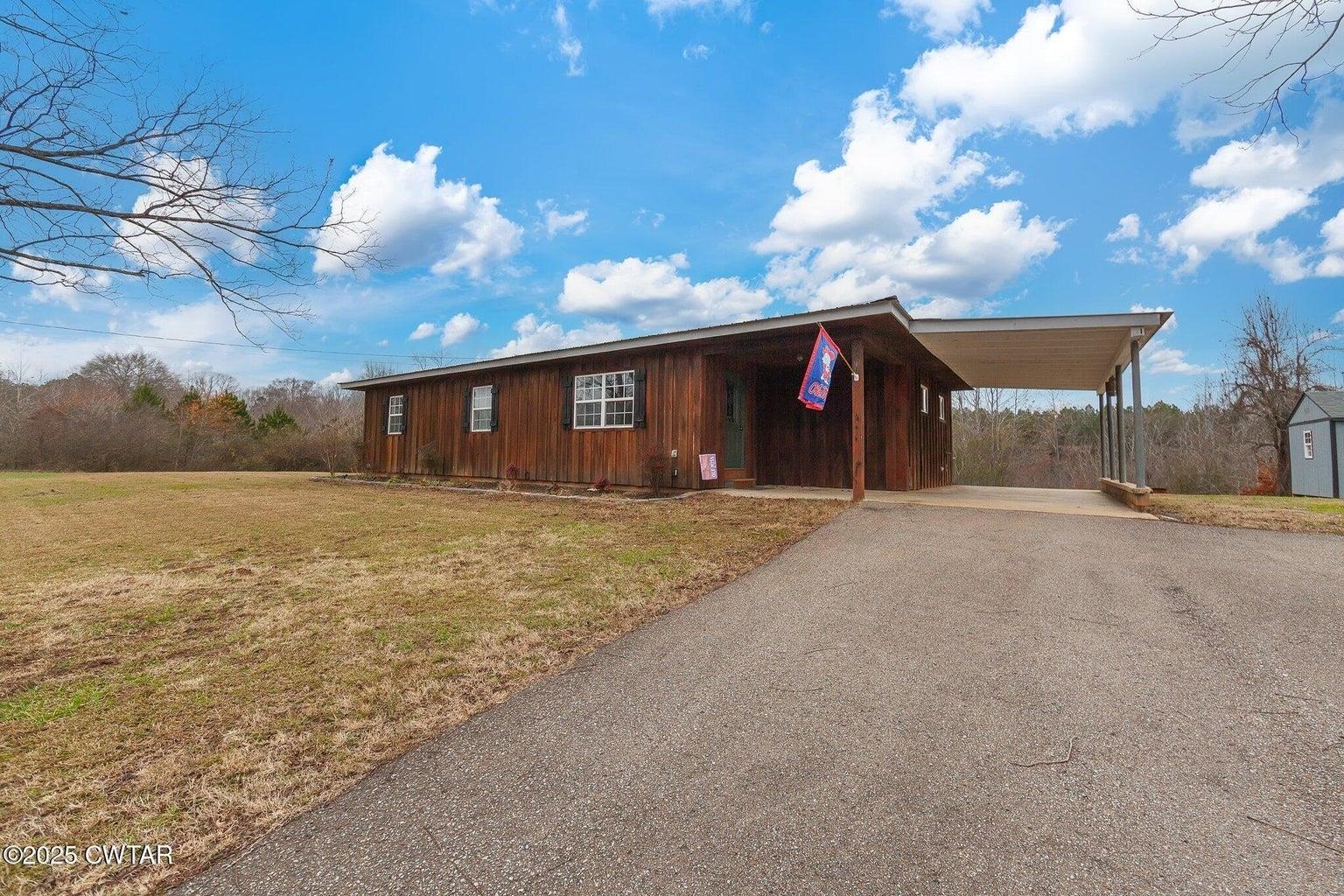 2510 Norton Road Middleton, TN 38052 - Photo 2 of 20 View of front of house featuring a carport and a front lawn