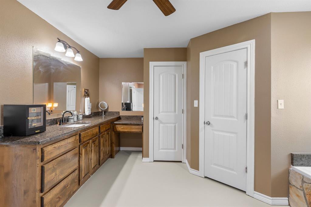 660 Milton-Minter Road Deport, TX 75435 - Photo 25 of 40 a kitchen with stainless steel appliances granite countertop a stove a sink and a refrigerator