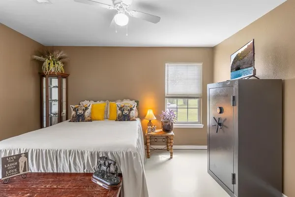 a bedroom with a bed and a table in it