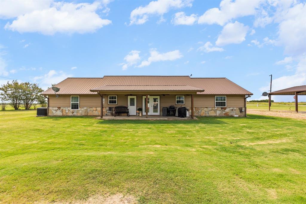 660 Milton-Minter Road Deport, TX 75435 - Photo 34 of 40 a front view of house with an outdoor space and seating