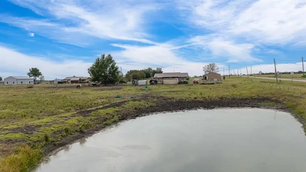 a view of a lake view with houses in back