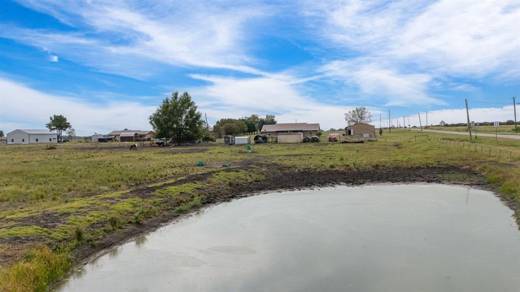 660 Milton-Minter Road Deport, TX 75435 - Photo 40 of 40 a view of a lake view with houses in back