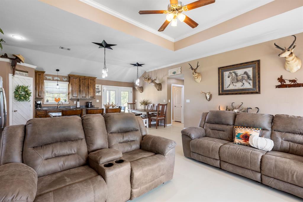 660 Milton-Minter Road Deport, TX 75435 - Photo 10 of 40 a living room with furniture and a view of kitchen