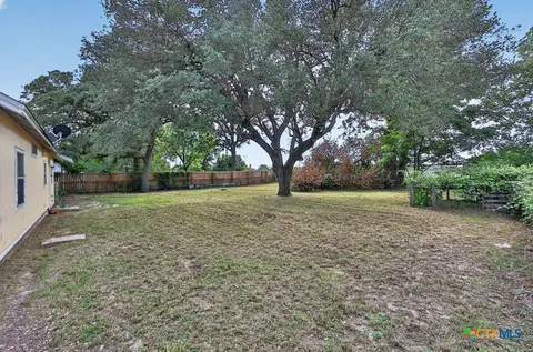 a view of outdoor space with deck and yard
