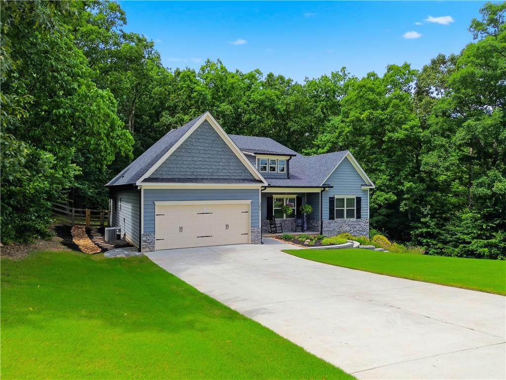 302 Spence Circle Ball Ground, GA 30107 - Photo 5 of 55 a view of a house with a yard in front of it