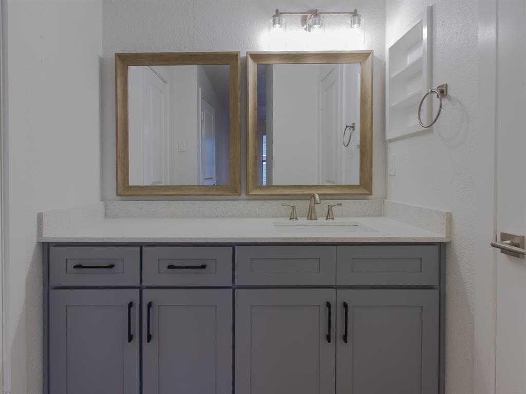 2240 Tarpley Road, Unit 62 Carrollton, TX 75006 - Photo 16 of 20 a bathroom with a sink and a mirror