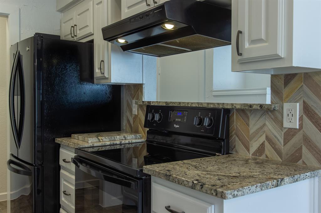 2240 Tarpley Road, Unit 62 Carrollton, TX 75006 - Photo 4 of 20 a kitchen with stainless steel appliances granite countertop a refrigerator and a sink