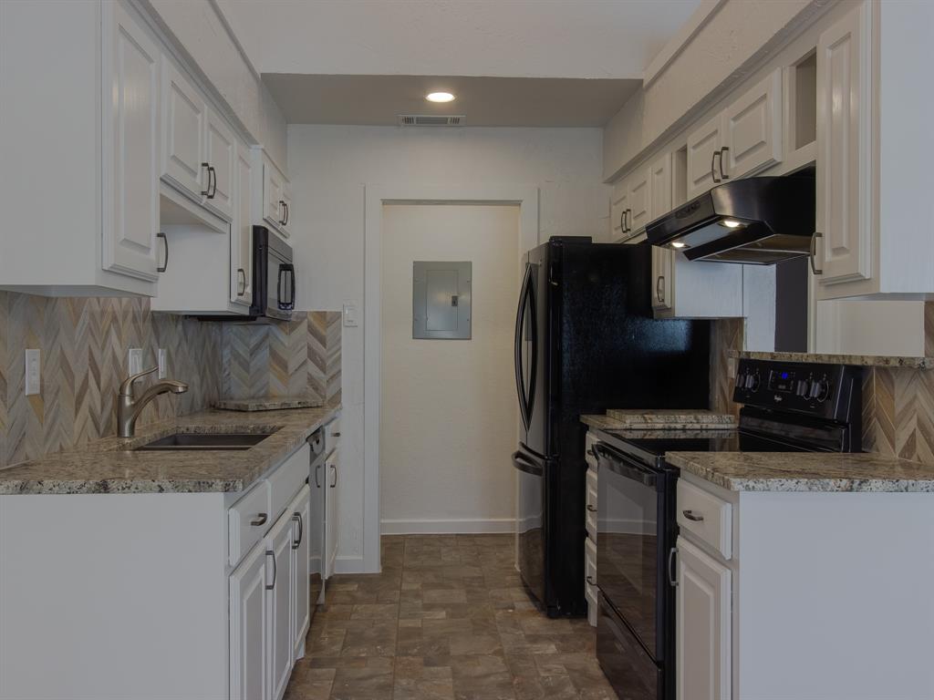 2240 Tarpley Road, Unit 62 Carrollton, TX 75006 - Photo 8 of 20 a kitchen with stainless steel appliances granite countertop a refrigerator a stove and a sink