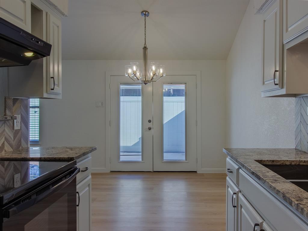 2240 Tarpley Road, Unit 62 Carrollton, TX 75006 - Photo 9 of 20 a kitchen with granite countertop a stove and a sink