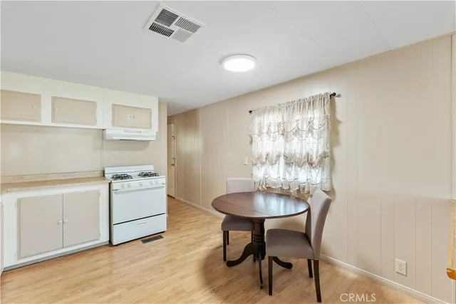 a room with a table and chairs in it