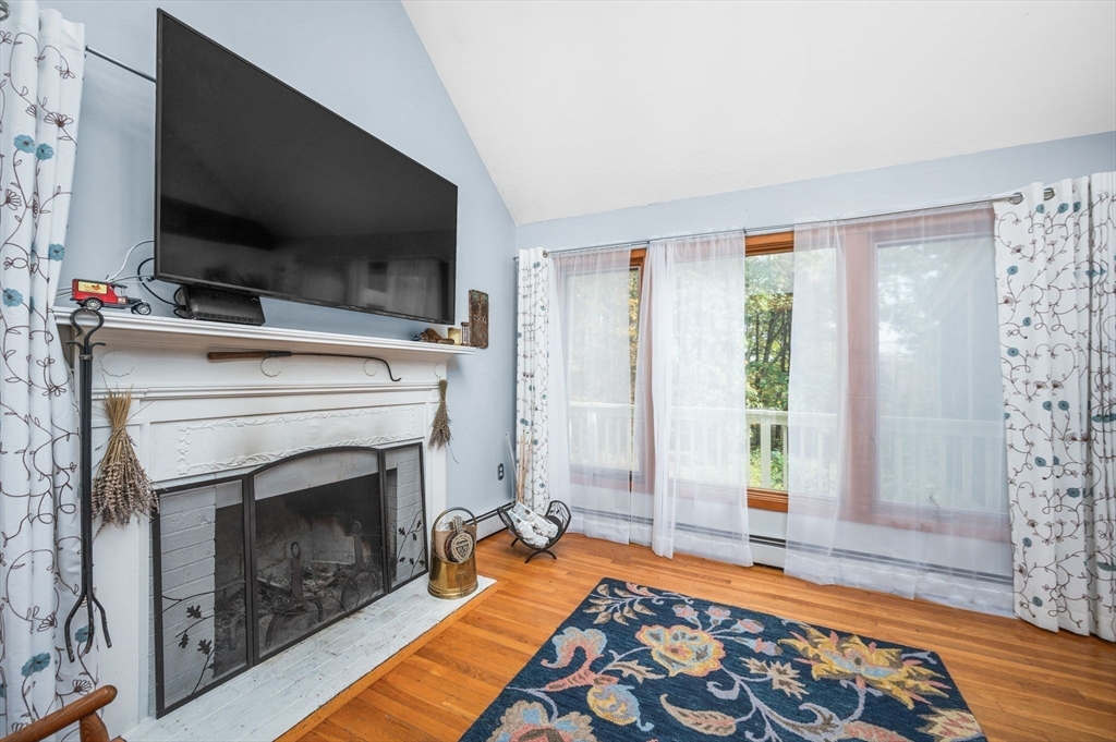 16 Wheeler Road Princeton, MA 01541 - Photo 11 of 40 a living room with furniture and a fireplace