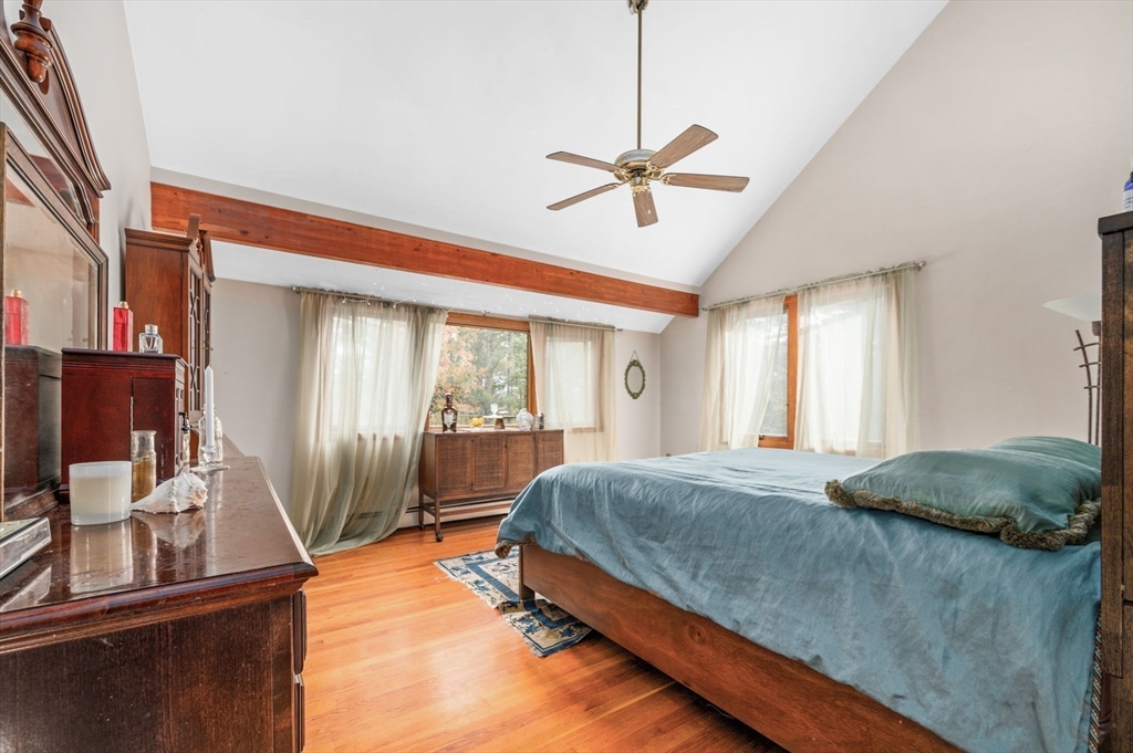 16 Wheeler Road Princeton, MA 01541 - Photo 17 of 40 a bedroom with a bed and large window with wooden floor