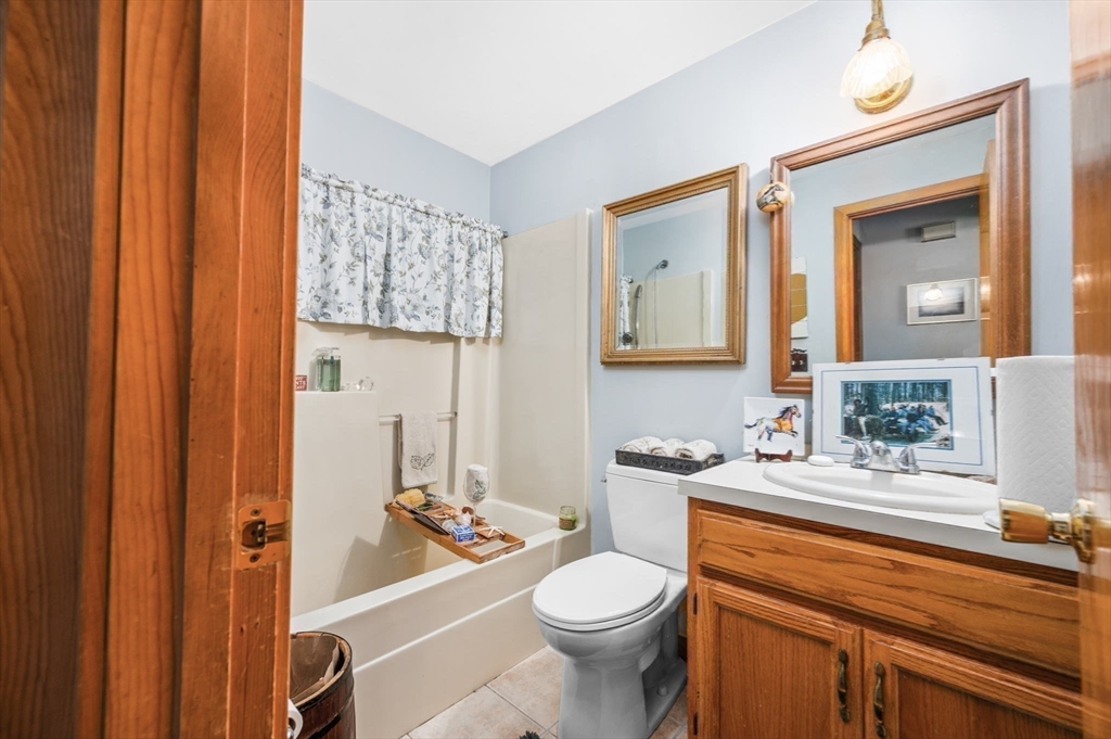 16 Wheeler Road Princeton, MA 01541 - Photo 25 of 40 a bathroom with a sink a toilet and shower