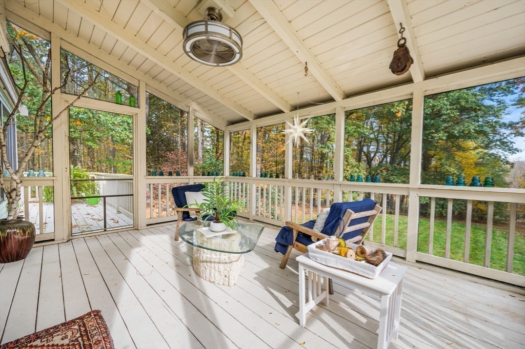 16 Wheeler Road Princeton, MA 01541 - Photo 26 of 40 a roof deck with table and chairs and wooden floor