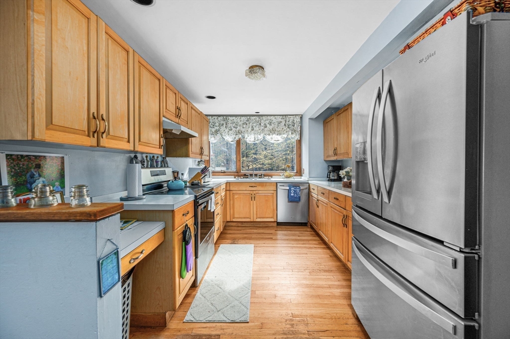 16 Wheeler Road Princeton, MA 01541 - Photo 4 of 40 a kitchen with granite countertop stainless steel appliances cabinets a sink and a large window