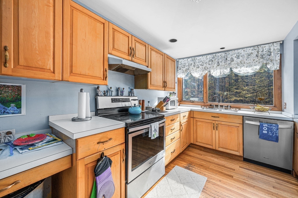 16 Wheeler Road Princeton, MA 01541 - Photo 5 of 40 a kitchen with stainless steel appliances granite countertop a stove a sink and a microwave
