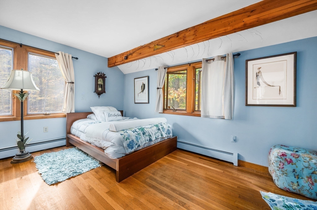 16 Wheeler Road Princeton, MA 01541 - Photo 9 of 40 a bedroom with a bed and wooden floor