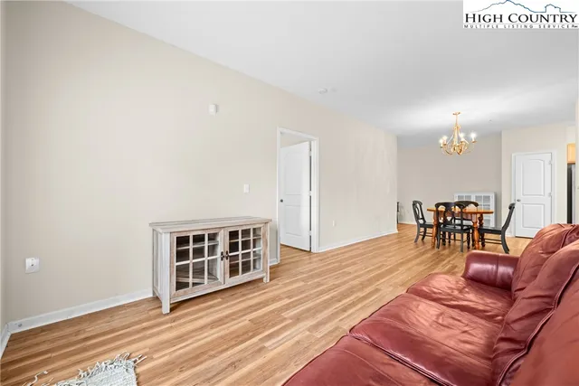 a view of a livingroom with furniture and wooden floor