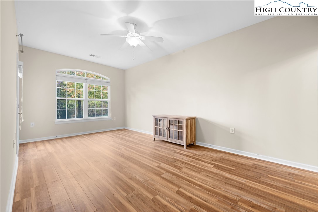 247 Eli Hartley Drive, Unit 111 Boone, NC 28607 - Photo 17 of 28 wooden floor in an empty room with a window