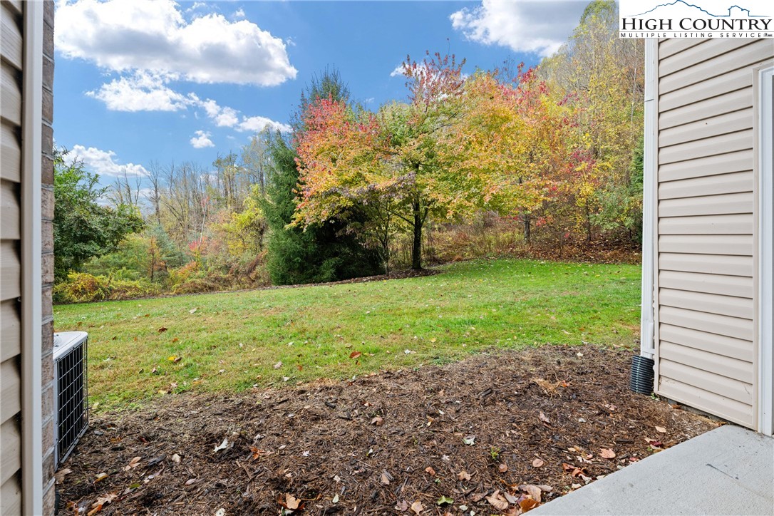 247 Eli Hartley Drive, Unit 111 Boone, NC 28607 - Photo 27 of 28 a view of a yard with a house
