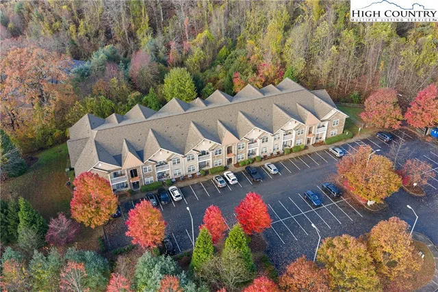 an aerial view of a house with yard swimming pool and outdoor seating
