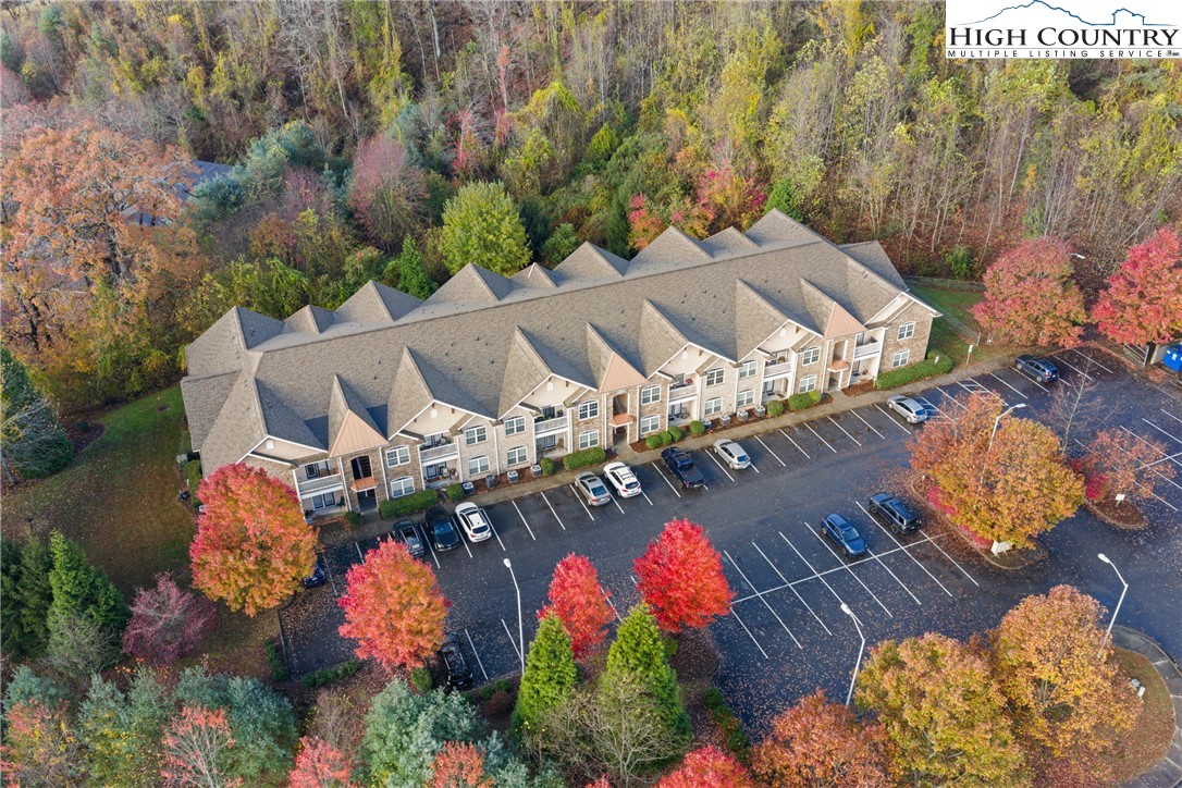 247 Eli Hartley Drive, Unit 111 Boone, NC 28607 - Photo 28 of 28 an aerial view of a house with yard swimming pool and outdoor seating