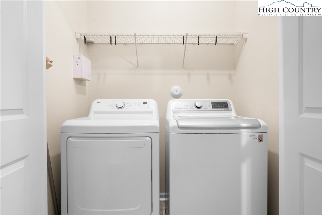 247 Eli Hartley Drive, Unit 111 Boone, NC 28607 - Photo 6 of 28 a utility room with dryer and washer