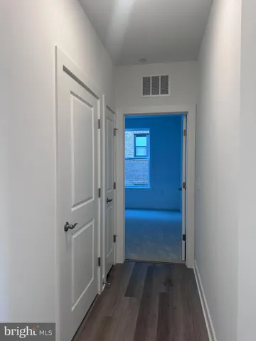 a view of a hallway and closet