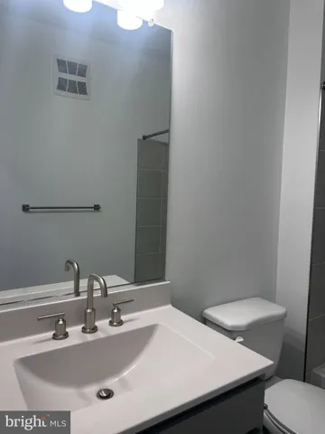 a bathroom with a sink and a toilet