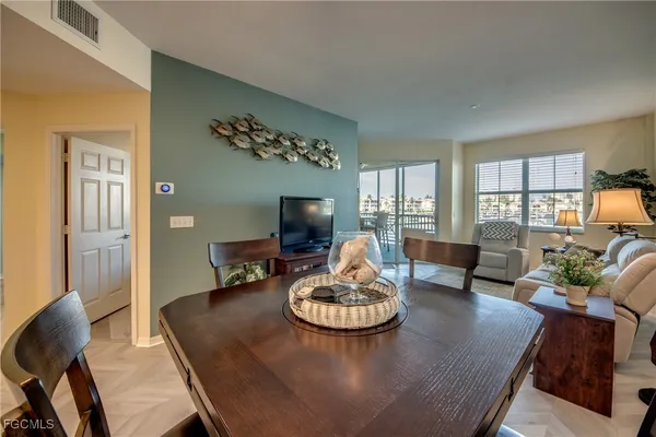 a living room with furniture and a table