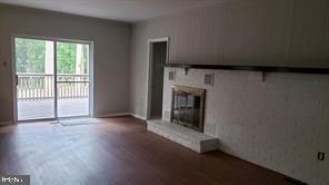 711 Brainerd Road Exton, PA 19341 - Photo 11 of 14 Family rm w/sliders to deck and fireplace