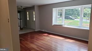 711 Brainerd Road Exton, PA 19341 - Photo 8 of 14 Living room w/bay window and hardwood flrs