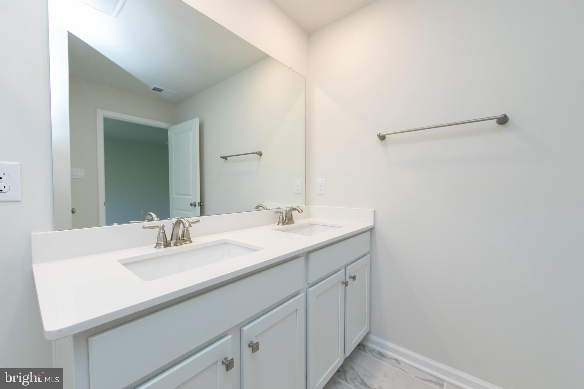 495 Monte Farm Road Mount Laurel, NJ 08054 - Photo 19 of 34 a bathroom with a sink and a mirror