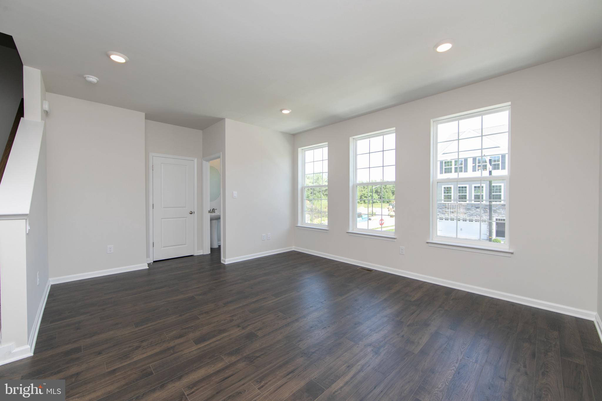 495 Monte Farm Road Mount Laurel, NJ 08054 - Photo 4 of 34 an empty room with wooden floor and windows