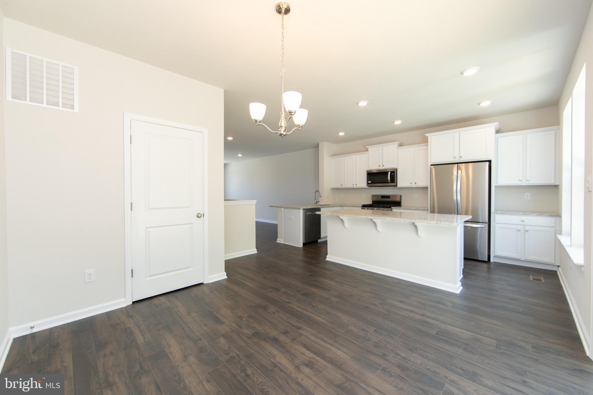 495 Monte Farm Road Mount Laurel, NJ 08054 - Photo 9 of 34 a view of kitchen with granite countertop cabinets and refrigerator