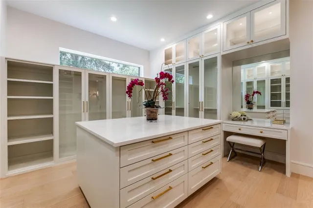 a bathroom with a toilet a sink a mirror a bathtub and next to a window