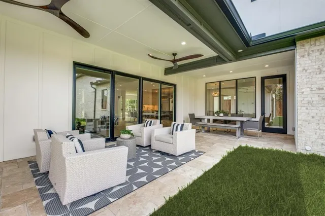 an aerial view of a house with a swimming pool yard and outdoor seating