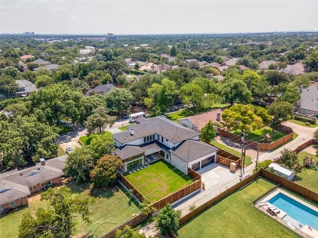 an aerial view of a house with a garden