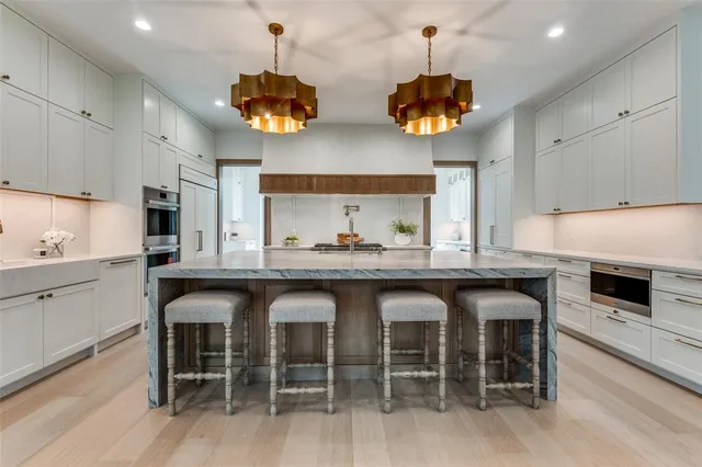 a kitchen with a table and chairs in it