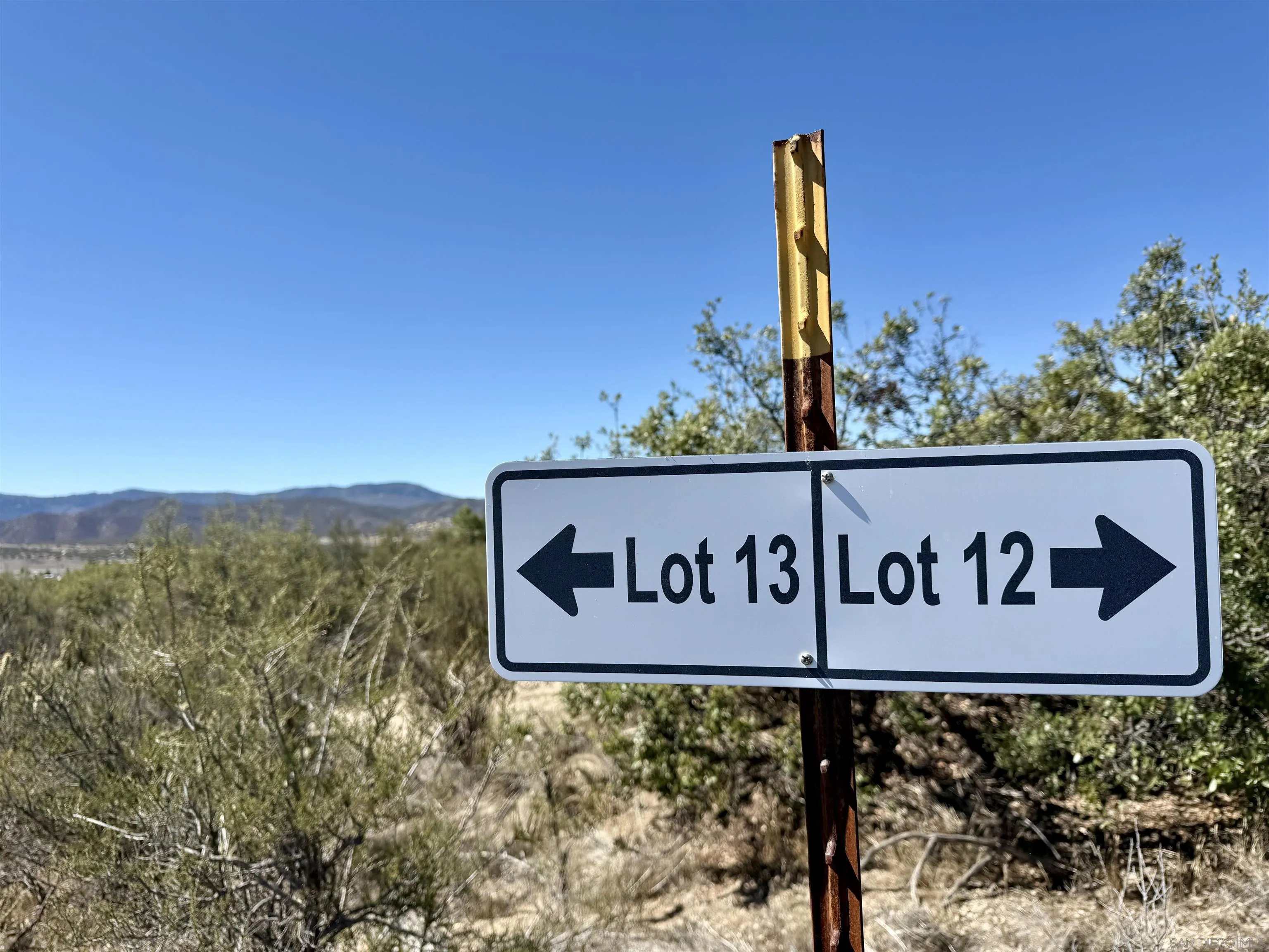 Mcconamara Drive, Unit 12 & 13 Ranchita, CA 92066 - Photo 3 of 20 a street sign that is on a pole