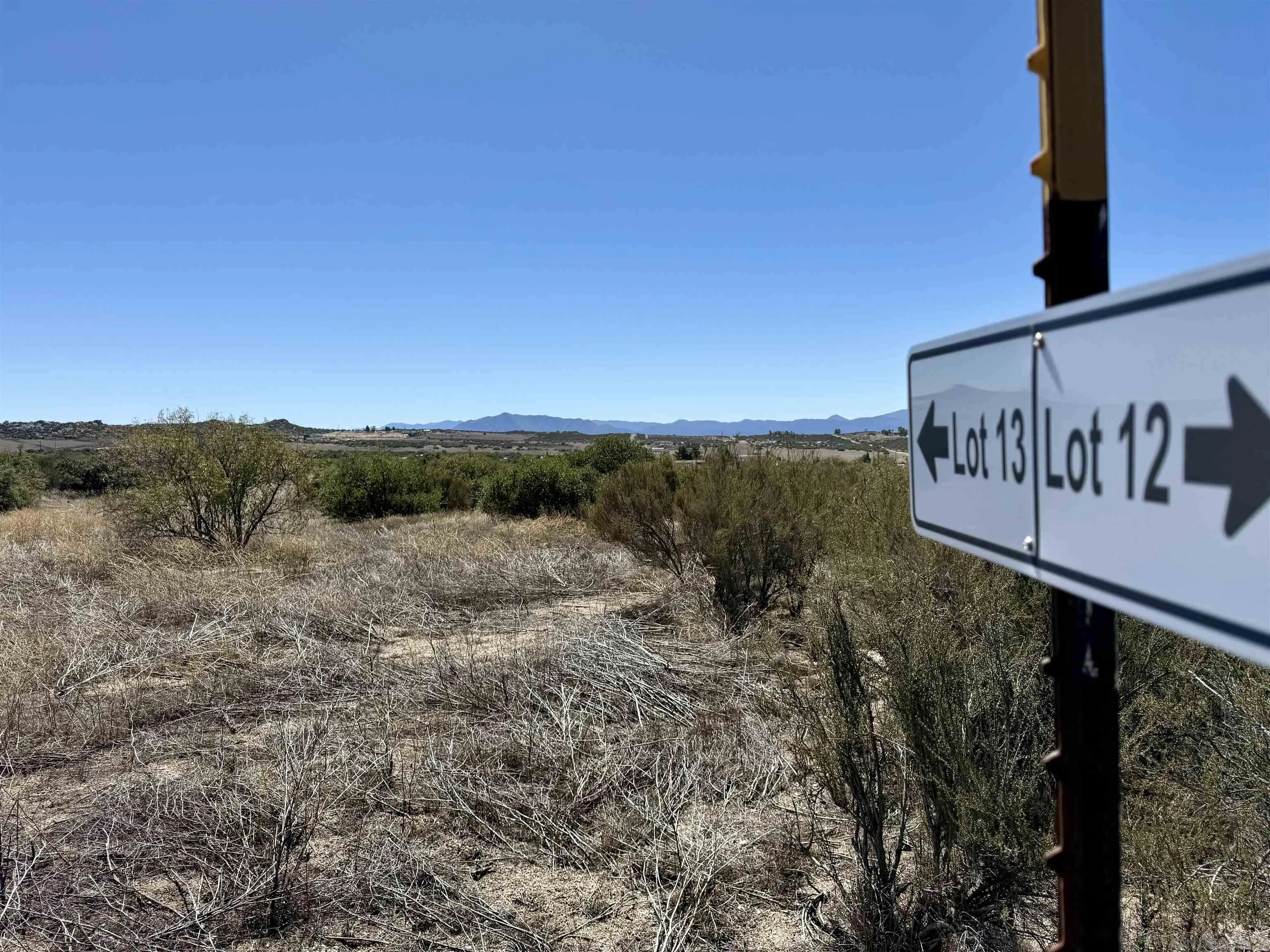 Mcconamara Drive, Unit 12 & 13 Ranchita, CA 92066 - Photo 10 of 20 a view of a street with a building in the background