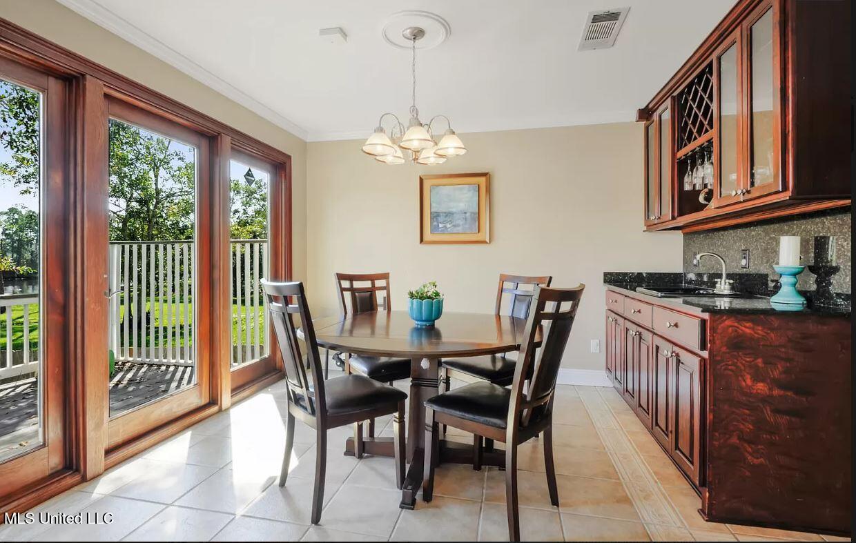 13 Keyser Lane Gulfport, MS 39507 - Photo 15 of 43 8.0 BAR.GAME EAST FACING BAYOU