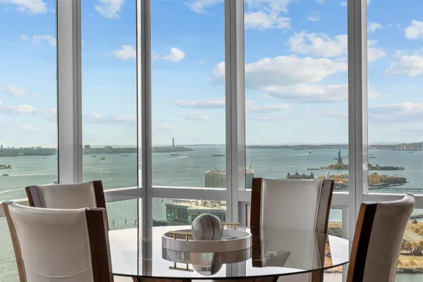 a view of a dining room with furniture window and outside view